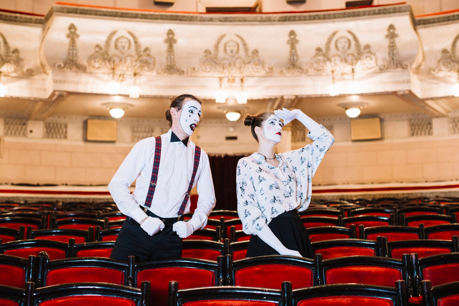 male-mime-looking-female-mime-looking-up-auditorium